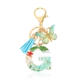 Resin letter G keychain with dried red flowers, blue tassel and butterfly charm - Letter G