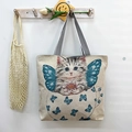 Off-white canvas tote bag with cute cat and butterfly print and striped handles - Angel Cat