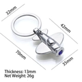 Silver 3D airplane keychain with blue gemstone accent and metallic finish - X-151 Airplane with Blue Crystal