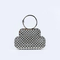 Close-up of a silver beaded evening bag with a metallic ring handle and modern shell shape - Silver