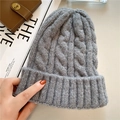 Detailed macro view of the grey chunky knit cable pattern on a warm winter beanie hat - M (56-58cm) / Gray
