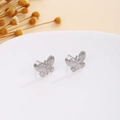 Detailed view of silver butterfly stud earrings with textured wings on a display tray - Silver Textured Butterfly (E7111)