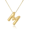 Detailed close-up of golden balloon style letter M pendant with engraved star patterns - Letter M / Gold