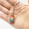 Close-up of a mini Christmas reindeer keychain made of soft silicone held in hand - Christmas Reindeer Style