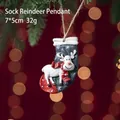Christmas stocking with reindeer hanging ornament on pine branch with bokeh background - Blue Red Sock Reindeer