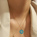 Golden Evil Eye sun relief pendant necklace with blue enamel on a minimalist cable chain - Round Evil Eye (DJN027GL-SB)