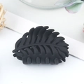 Matte black leaf shaped hair claw clip with cutout design on a clean white surface - Matte Leaf Style / 40x25x35mm / Black