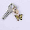 Cute gold butterfly keychain with yellow wings and heart clasp on silver key - Yellow Black Butterfly