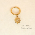 Detailed view of 14K gold plated hoop earring with sun pendant and tiny crystals - Starburst with Zirconia