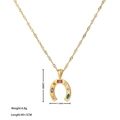 Gold horseshoe necklace with multicolor zircon stones and dimensions annotations - Gold