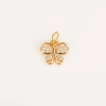 Macro shot of gold butterfly charm with micro-pave cubic zirconia and top hanging loop - Butterfly