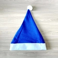 Classic blue non-woven Santa hat with white fur trim and pompom on wooden background - Ordinary Non-woven Adult Style (30x40cm) / Blue