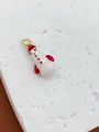 Macro view of cute snowman pendant with red hat and golden ring on marble background - Red Hat Snowman Pendant