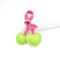 Detailed view of pink leather cherry charm with green leaves and a metal snap button - Green
