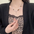 Elegant pearl and bead necklace with cross pendant shown on model neck - Cross Multi-Material Bead Necklace (X4848)