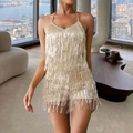 Close-up of sparkling gold sequins and layered fringe detail on a halter neck dress - Champagne