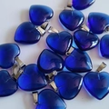 Dark blue crystal heart pendant with silver metal bail on a clean white background - Dark Blue Glass