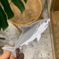 Close-up of a cute shark-shaped acetate hair claw clip in grey and white colors - Dark Gray Shark White Eye