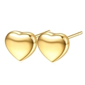 Vista macro di orecchini a lobo a cuore lucidati in finitura oro brillante, stile minimal - Orecchini d'oro