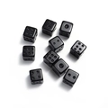 Detailed view of ten black six-sided crystal stone dice scattered on white background - Black Stone