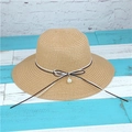 Detail of hand-woven straw sun hat showing pearl pendant and bicolor bow ribbon - M (56-58cm) / Khaki