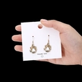 Golden Christmas bell drop earrings with white enamel coating and bow details - White Bell