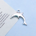 Silver dolphin-shaped metal pendant charm for DIY jewelry making in a sea theme - 19x13mm / Antique Silver Dolphin