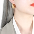 French retro 18k gold plated titanium earrings with zircons shown on a female model - Gold