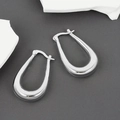 Detailed view of silver U-shaped earrings with a polished finish and latch back closure - Elongated U Hoop / Silver