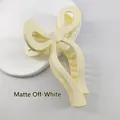 Matte beige bow shark hair clip for women with minimalist plastic finish and metal spring - Matte Cream