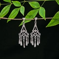 Detailed view of vintage silver tassel earrings with geometric frame on a tree branch - E4976-1 (Geometric Vintage)