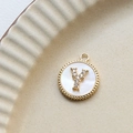 Macro shot of 18k gold plated round shell pendant with zircon inlaid letter Y - Y Round