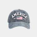 Close-up of washed cotton baseball cap with AMERICA embroidery and US flag patch - Adjustable / Navy Blue