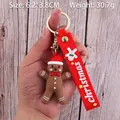 Gingerbread man keychain with red Christmas hat and silicone strap, 6.2x3.8cm size - Christmas Gingerbread Man-4