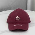 Close-up of vintage burgundy baseball cap with white M embroidery and distressed brim details - One Size (58-60cm) / Burgundy