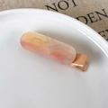 Macro detail of rectangle resin hair clip with pink and gold glitter mica texture - Orange Dazzling