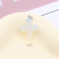 Cross pendant crafted from translucent milky white opal stone with a metallic bail - Opal White