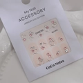 Detailed view of 5D pink rhinestone nail art stickers with metallic rings and diamond decals - Model MJ-063 Silver Foil