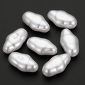 Irregular baroque white pearl beads for DIY jewelry making on dark background - 19x11mm