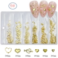 Detailed view of golden heart and Cupid's arrow nail charms in size 5x6mm and 4x8mm - GZMD-09 Gold Hearts and Arrows