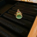 Macro shot of 18K gold plated ring with green cat eye stone gourd and zircon details - Green Cat's Eye Gourd Ring