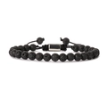 Detailed macro view of black volcanic lava stone beads and silver metal clasp on woven bracelet - 6MM Lava Stone