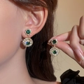 Luxurious gold drop earrings with a vintage green stone and sparkling white crystals - Gold Green