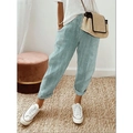 Close-up of blue and white striped loose trousers with woven jacquard texture and detail - Light Green