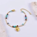 Bracciale vintage francese con perline, ciondolo a cuore dorato e incisione a croce - Stile Cuore