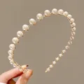 Elegant white pearl headband for girls featuring a gold wavy metal frame design - Style 1 Simple Pearl