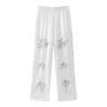 White high-waist wide-leg pants with elegant black floral embroidery and elastic waist - XS / White Pants