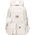 Detalle de mochila blanco roto con colgante de peluche, bolsillos y parches lindos - Con pompón blanco / Blanco lechoso