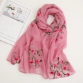Detailed view of pink floral embroidery on lightweight semi-sheer chiffon beach scarf - Dusky Pink