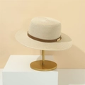 Minimalist beige straw sun hat with brown leather band on a professional display stand - M (56-58cm) / Beige